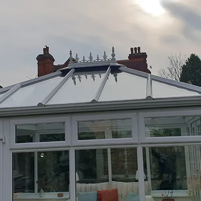a large white house with a glass roof